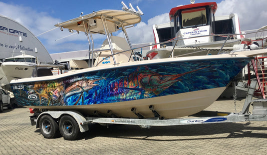 a boat wrap that features a Mahi Mahi, Sailfish and a Marlin