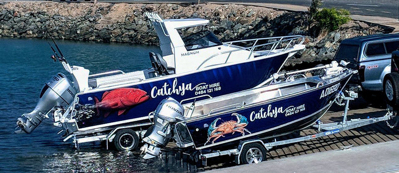 Catchya boat hire boats with a mud crab and coral trout