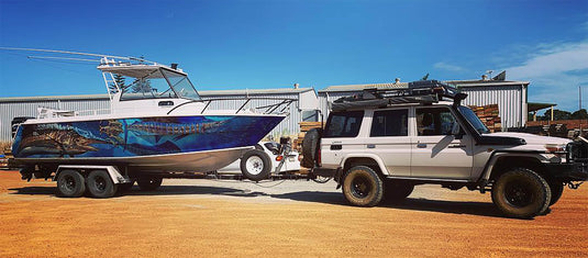 a picture of a boat wrap that feartures Sailfish